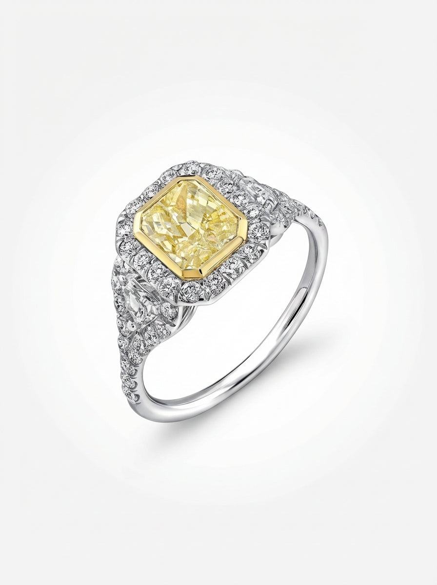 Diamond ring with a yellow gemstone on a white background