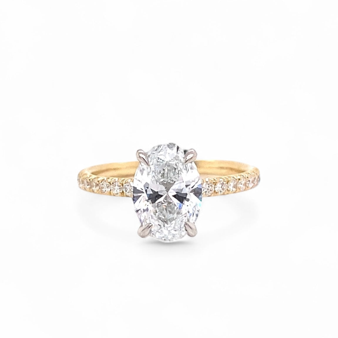 Oval two tone 14 karat yellow gold/platinum lab grown diamond ring