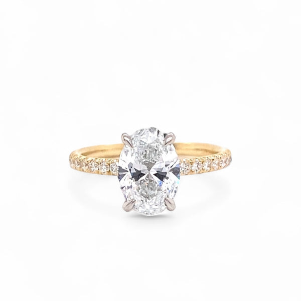 Oval two tone 14 karat yellow gold/platinum lab grown diamond ring